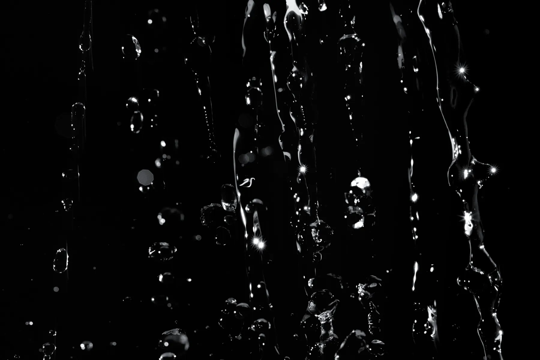 Without the swerve, Lucretius wrote, every atom would fall "like drops of rain" straight down through the deep void, and nothing would ever meet (Book II, 221–222). Photograph by Aleksandar Pasaric, Pexels.