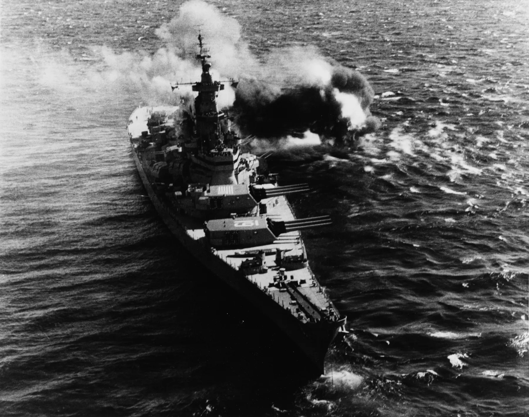 Iowa fires her 16-inch guns at enemy coastal defences off Koje, Korea, 17 October 1952, the day after she completed her Korean War combat operations. US Naval Institute Photographic Collection, via the Naval History and Heritage Command (NH 92213).