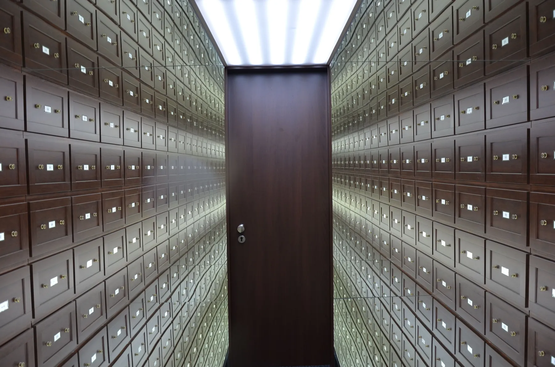 A vault lined with lockboxes. The mathematics of the band says to leave the money alone most of the time, and to know exactly where the edges are. Photograph by Ehtiram Mammadov, Pexels.