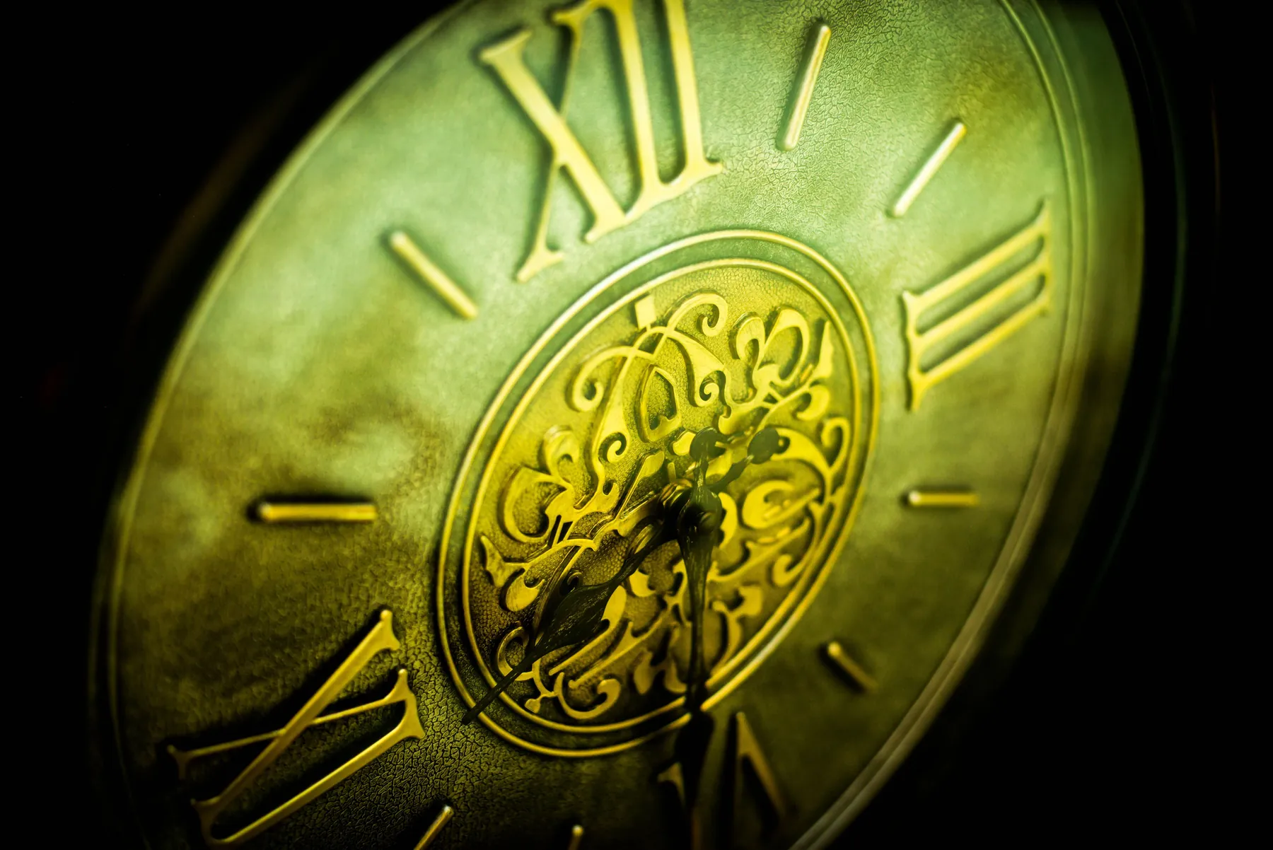 The face of an old clock, close up.
